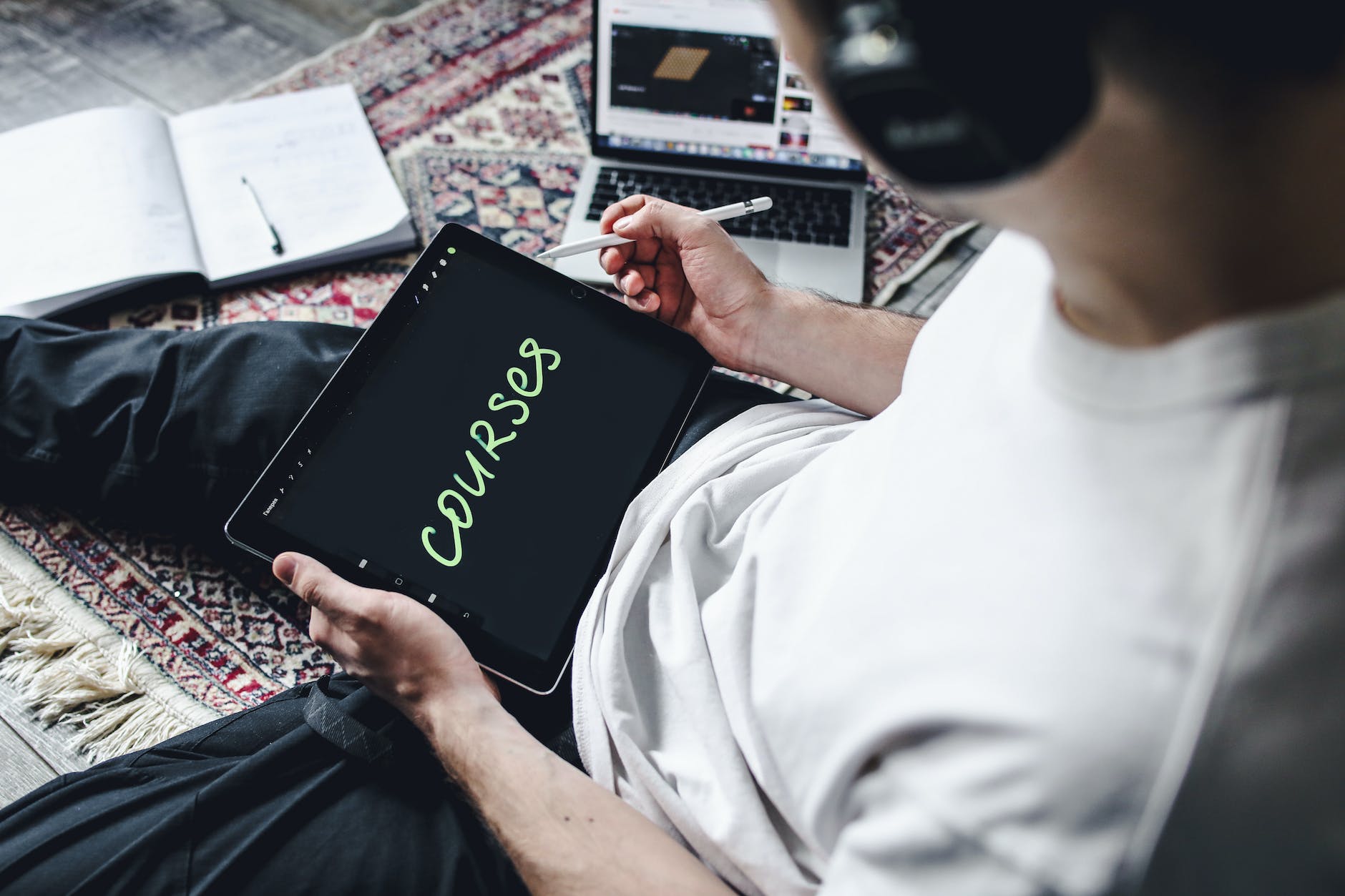 a person holding a digital tablet